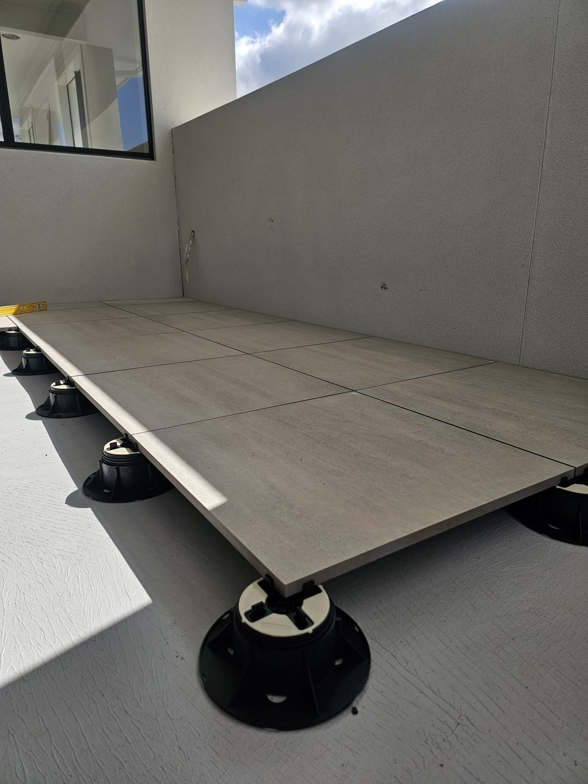 Large-format pavers set on a pedestal tiling system